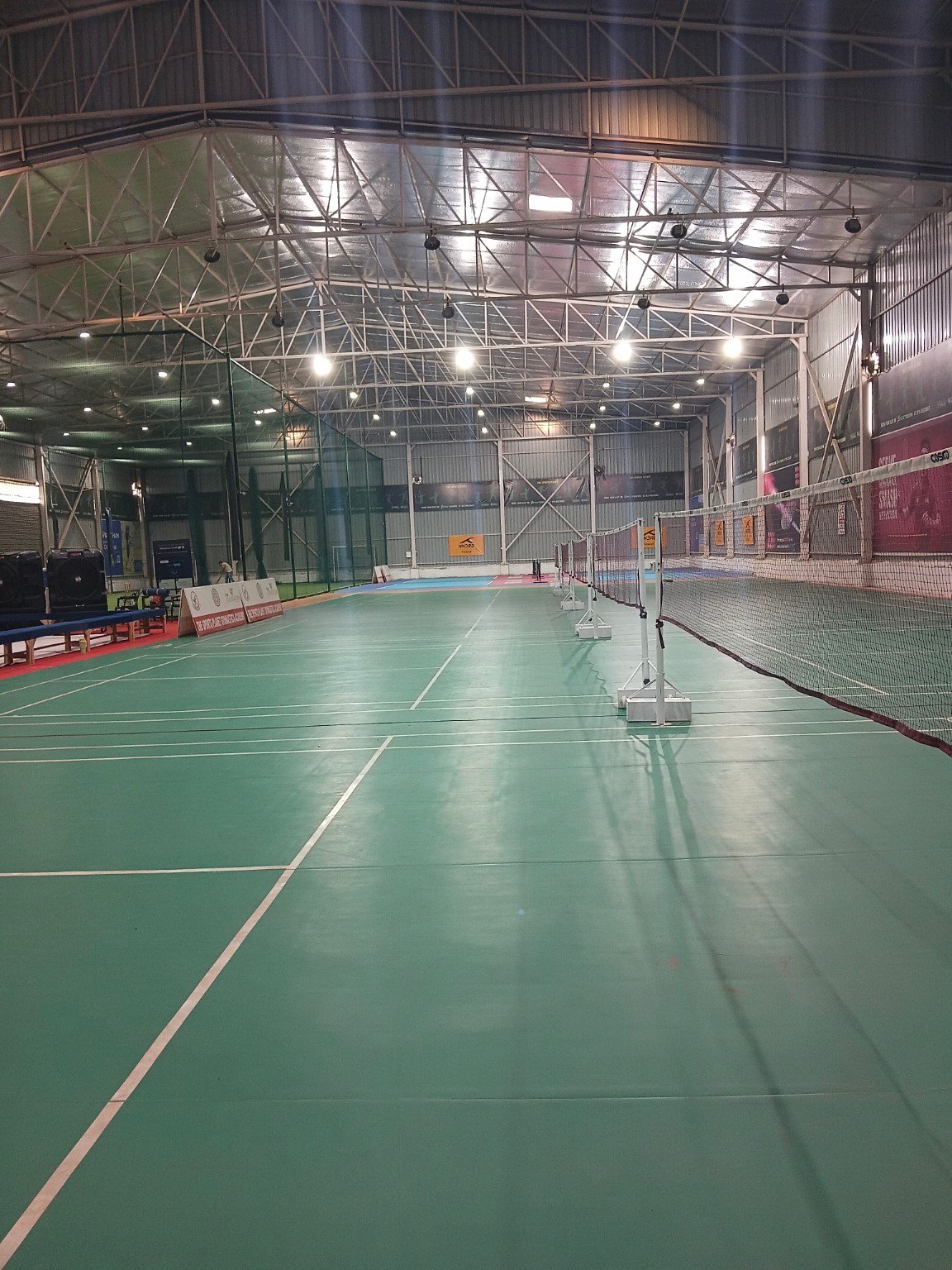 Indoor badminton courts at FatherSaab International Badminton Academy